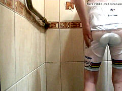 jerking under bathroom in white bicycle clothing