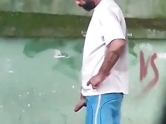 spying on drunk guy pissing on the street